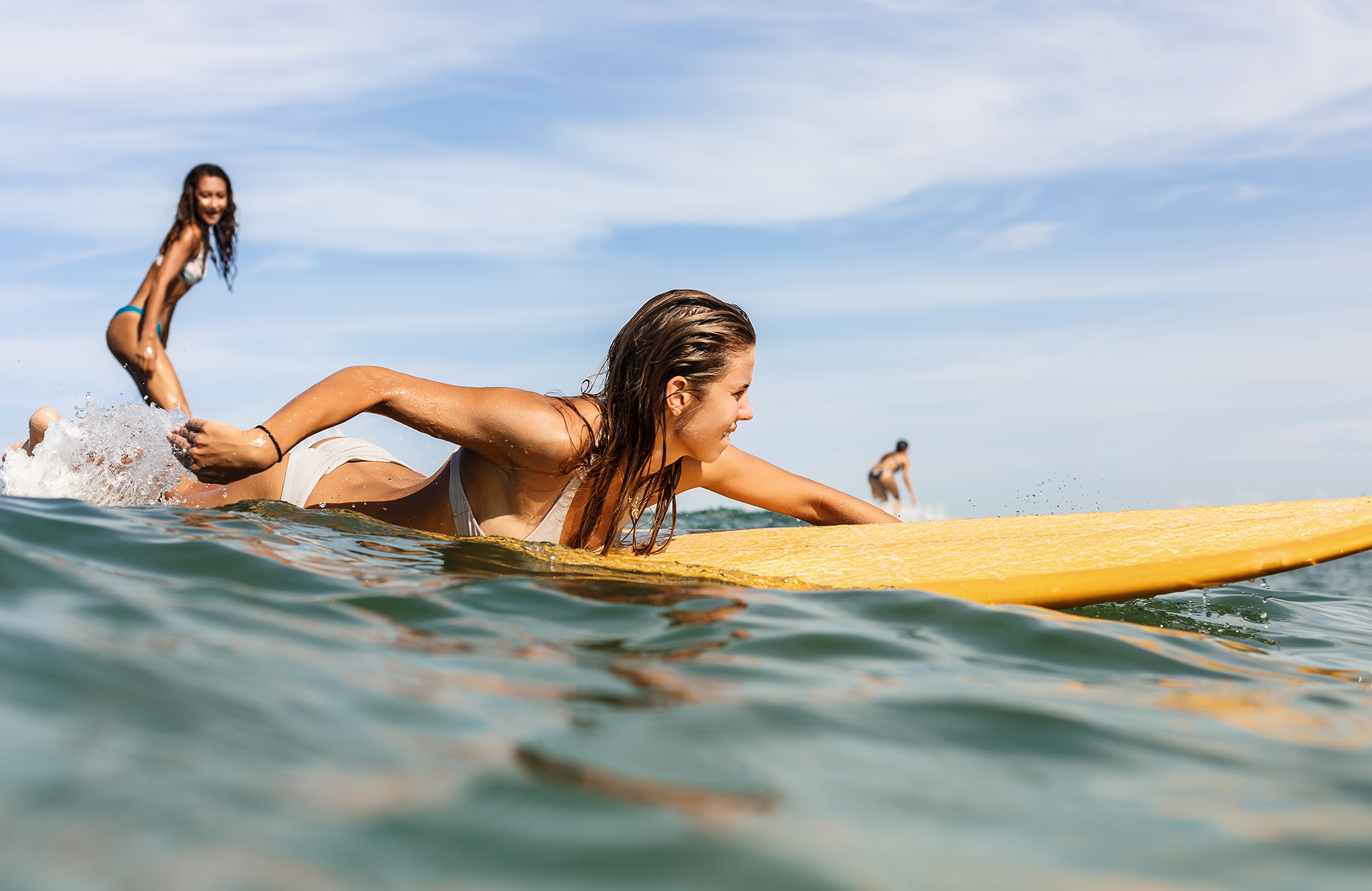 surfing-two-women-small-wave-cover