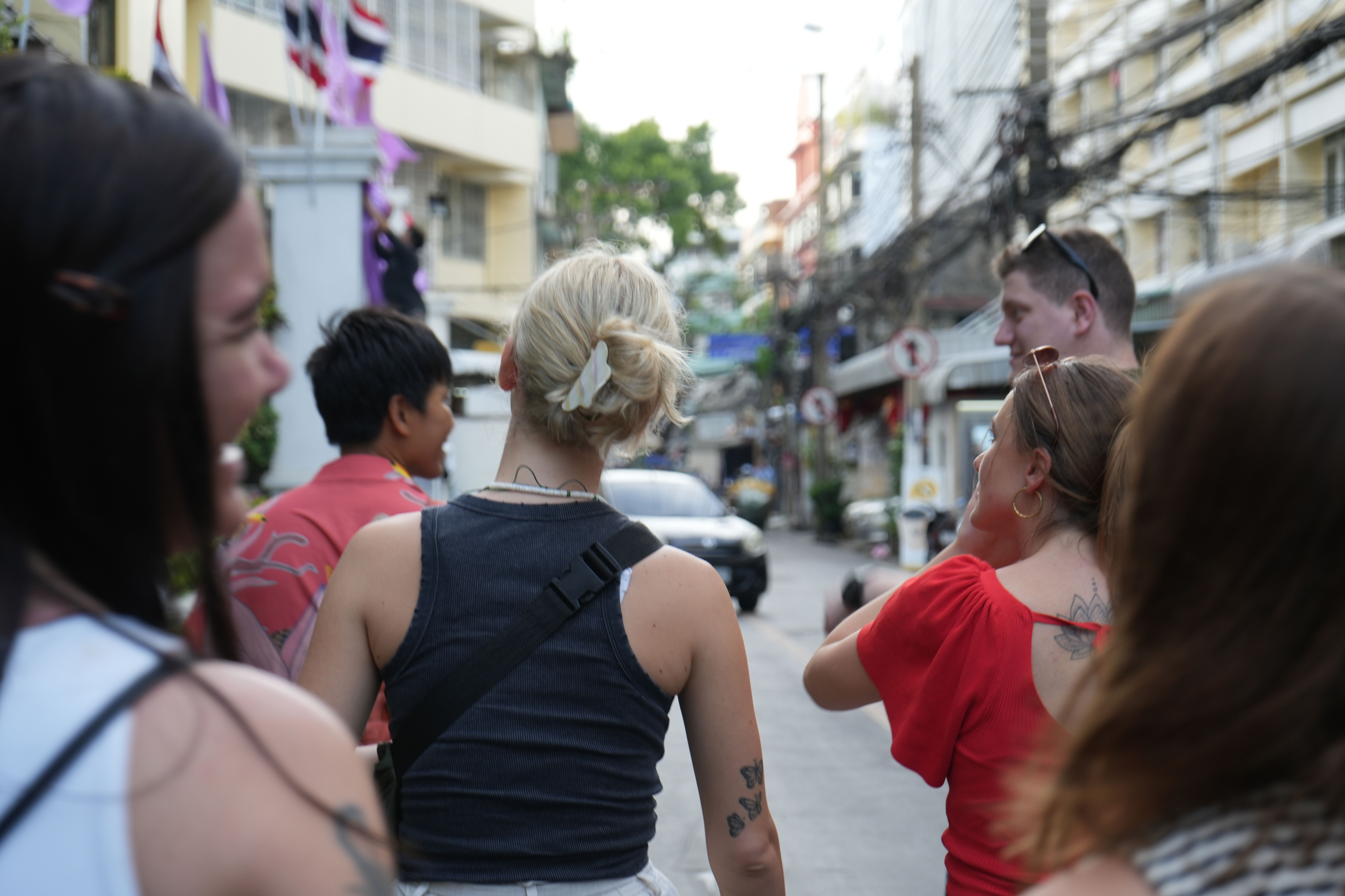 Freja And Her Travel Group Walking Through Bangkok