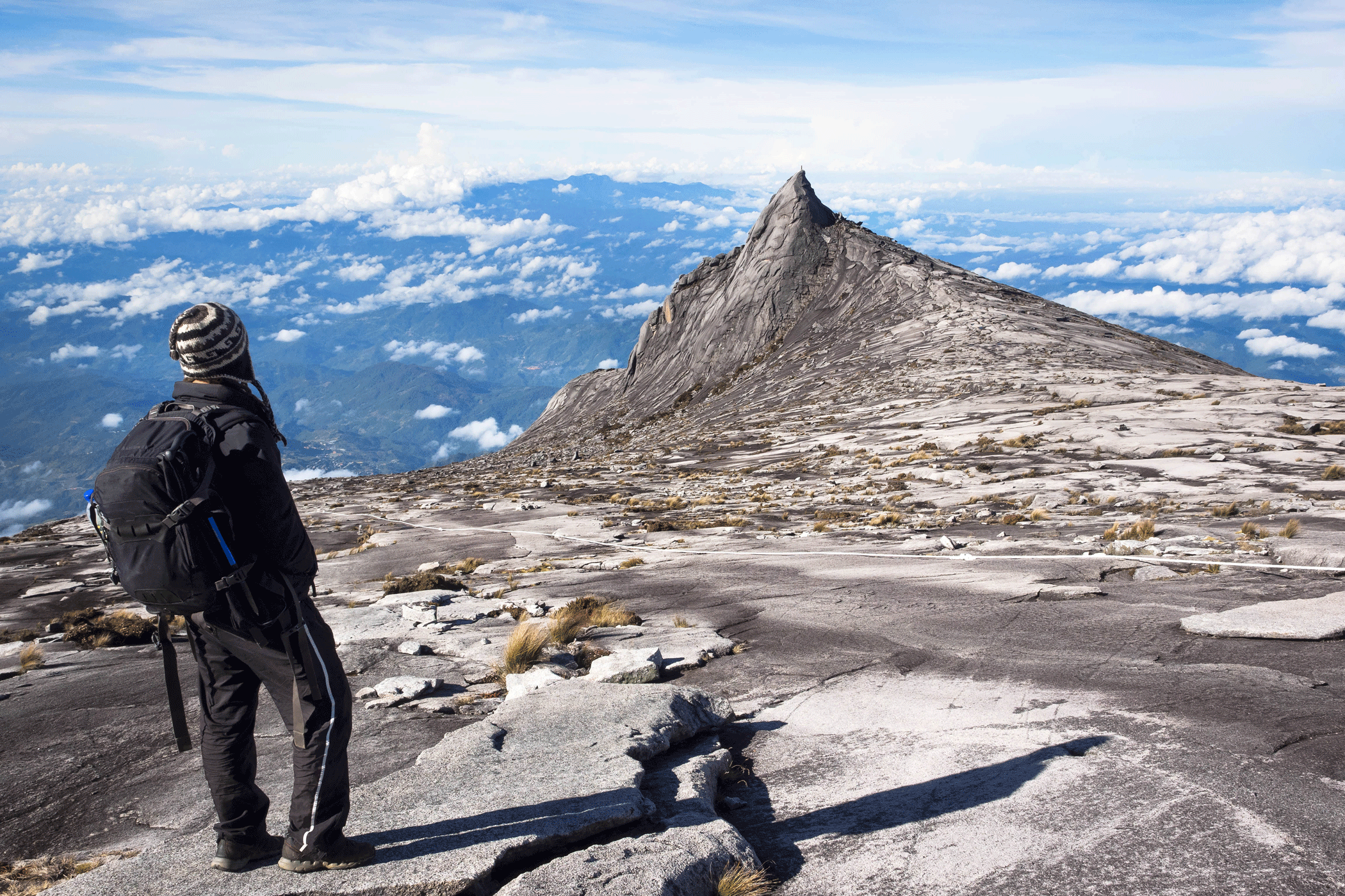 Man On Top Of Mount Kinabalu On Borneo